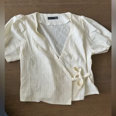 Cream Wrap Blouse. Shein. Never Worn Beige Short Sleeve Blouse For Brunch, Spring Cream Wrap Top, Elegant Cream V-neck Blouse, Cheap Cream Button-up Top, Cream Cotton Button-up Blouse, Cheap Cream Button-up Blouse, Yellow Raincoat, Shein Tops, Wrap Blouse