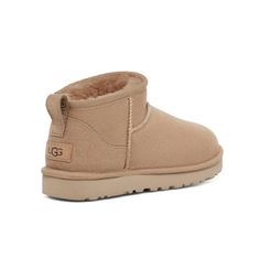 The Classic Ultra Mini updates our most iconic silhouette with a lower shaft height, adding easy on-off and enhanced versatility. Pre-treated to keep it looking better for longer, this Classic features everything you love about the original like signature UGG sheepskin and a flexible, lightweight sole. Wear with virtually anything – the styling options are endless. Ugg Classic Mini Chopd, Ugg Ultra Mini Beige, Ugg Ultra Mini Ii, Sand Ultra Mini Uggs, Ugh Ultra Mini, Ugg Mini Boot, Ugh Boots, Swimsuit Jewelry, Cream Boots