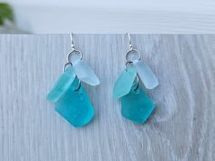 This pair of blue and aqua/sea foam sea glass earrings features 6 pieces of small sized aqua/green, clear, and blue sea glass (each piece is different shapes and tones).  The weight is not heavy, comfortable to wear. The dangle drops are  about 1" (30mm)long the 1/2" (20) wide. You can choose the earrings hooks or posts style in the "hook material" option.  I offer solid sterling silver hooks, stainless steel hooks, and stainless steel posts (shown as picture, the loops/jump rings that connectin Blue Sea Glass Nickel Free Earrings, Blue Sea Glass Nickel-free Earrings, Handmade Blue Sea Glass Earrings, Nickel-free Blue Sea Glass Earrings, Blue Recycled Glass Dangle Earrings, Blue Recycled Glass Nickel-free Earrings, Nickel-free Blue Recycled Glass Earrings, Blue Nickel-free Recycled Glass Earrings, Blue Sea Glass Dangle Jewelry