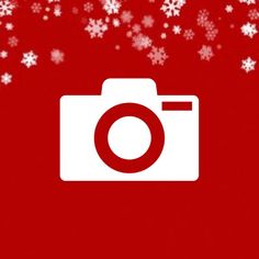 a red background with white snowflakes and a camera