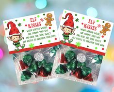 two christmas candy bags with elf kisses and gingerbreads on them in front of a blurry background