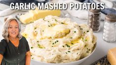 a woman standing next to a bowl of mashed potatoes