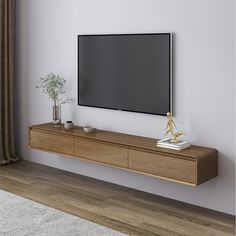 a flat screen tv mounted to the side of a wooden shelf in a living room