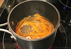 the food is being cooked in the pot on the stove