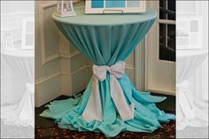 a table with blue and white cloth draped over it