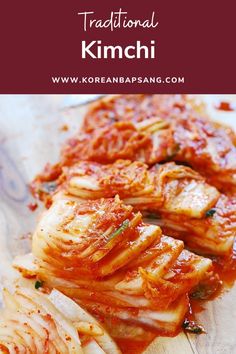 some kind of food that is on a wooden cutting board with text overlay reading traditional kimchi