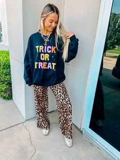 Get into the spirit of Halloween with this sweatshirt! I love these vibrant colors on this black base soooo much! Throw this on with a pair of leggings & get to trick-or-treating! 50% cotton so it won't shrink a whole lot Model is 5'4 wearing a size XL for an oversized look Trendy Black Halloween Sweatshirt, Fall Black Letter Print Sweatshirt, Black Letter Print Sweatshirt For Fall, Oversized Halloween Sweatshirt For Loungewear, Trendy Black Sweatshirt For Fall, Fun Fall Loungewear Tops, Spooky Fall Sweatshirt For Streetwear, Spooky Style Fall Sweatshirt For Streetwear, Spooky Black Halloween Sweatshirt