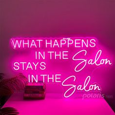 a neon sign that says, what happens in the salon stays in the salon?