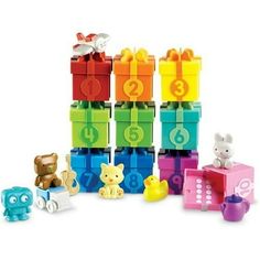 a group of toys that are in the shape of animals and numbers on them, all stacked up together