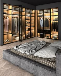 a large walk - in closet with clothes and shoes on the floor, next to a bed