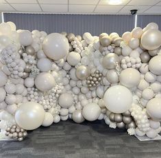 a large number of balloons are arranged in the shape of an elephant on a wall