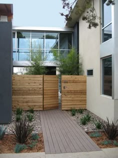 an image of a house with wooden fence and plants in the front yard, as well as text that reads 25 four seasons garden