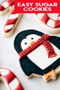 decorated cookies in the shape of penguins and candy canes