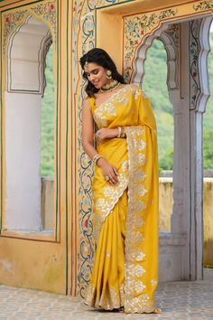 Gorgeous yellow tussar georgette saree is a perfect choice for weddings and festive occasions!. It has an embroidered scalloped border and comes with a saree blouse piece. Disclaimer: The actual product may vary slightly from the image. These are custom orders, hence expect slight variation in color, placement of the motif or buta. ESTIMATED DELIVERYBecause this is a custom order, it would take about 4 weeks from the date of purchase. RETURN POLICYThis product is a custom order and cannot be returned or exchanged. Yellow Sarees, Scalloped Border, Yellow Saree, Wedding Sarees, Embroidered Border, Georgette Saree, Saree Online, Designer Sarees, Georgette Sarees