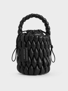 This product is made with at least 20% sustainable materials by weight. CHARLES & KEITH uses recycled, degradable, organic, and water-based materials in our eco-conscious collection.Stand out from the crowd this season with this Bia bucket bag in timeless black. Featuring an eye-catching woven finish that adds both visual and textural interest to the design, this understated carrier will be the star of all your outfits, from polished date-night ensembles to casual off-duty looks. Perfectly sized Black Saddle Bag, Lux Fashion, Vetements Clothing, Chic Crossbody Bag, Buy Bags, Classic Handbags, Bags Shop, Charles Keith, Handbags Online