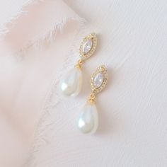 Megan are a classic pearl teardrop earring with a modern CZ  stone design giving beautifully timeless allure. Made with delicate pave set crystals and drops of glistening pearls.  This refined pair of bridal earrings will be the perfect addition to complete your bridal look. Details   Length 3.2cm  Width 1cm  All our jewellery comes perfectly packaged in our custom jewel box. Modern Pearl Drop Earrings, Bridal Earrings With Updo, Pearl Bride Earrings, Bride Earrings Pearl, Bridal Earrings Gold, White Couture, Bridal Pearl Earrings, Pearl Teardrop Earrings