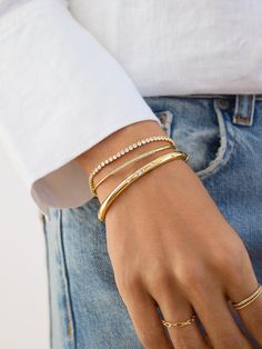 Let your bangles do the talking. The Destiny Bangle is classically chic with three shining cubic zirconia stone to add some bling. Featuring a hinge to open and magnetic closure, this easy to take on and off bangle will become a definite staple. Gold Medallion Necklace, Gold Bracelets Stacked, Pave Bangle, Classic Bangles, Safety Pin Earrings, 18k Gold Earrings, Gold Bead Bracelets, Gold Ring Sets, 18k Gold Ring