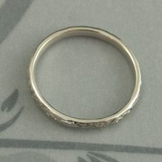 White Gold Skinny Flourish Band Women's Wedding Band Women's White Gold Band Vintage Style Band Antique Style Ring White Gold Wedding Band This is a slimmer version of our Flourish Le Femme band: https://www.etsy.com/listing/151251996 And our Flourish Wide: https://www.etsy.com/listing/179128813 At a dainty 2.4mm wide by 1.5mm thick, this is the perfect thinner wedding band or stacking ring. You simply can't do without it! Pair it with your other stacking rings or wear it alone as a symbol of yo White Gold Round Band For Wedding, White Gold Round Wedding Band, Heirloom Wedding Band Adjustable, Classic Adjustable Wedding Bands, Wedding Bands With Diamond Cut In Silver, Silver Wedding Bands With Diamond Cut, Silver Diamond Cut Wedding Bands, White Gold Wedding Ring With Decorative Band, Silver Diamond Cut Bands For Wedding