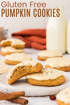 gluten free pumpkin cookies on a plate with cinnamon sticks and milk in the background