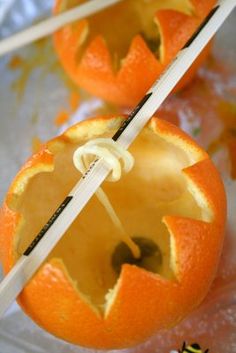 two oranges that have been cut in to look like jack - o'- lanterns