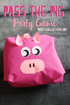 a pink pig bag with the words pass the pig party game on it