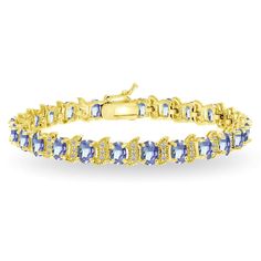 This gorgeous S and oval tennis bracelet displays glistening oval-cut 6x4mm tanzanite gemstones that are set in between an S design studded with sparkling white topaz accents. The bracelet is created of yellow gold flashed sterling silver and is nickel free. It secures with a box and tongue plus a safety latch. Look and feel glamorous with this luxurious piece of jewelry! Product Details Metal Type yellow-gold-flashed-silver Metal Stamp 925-sterling Weight 19.3GR Length 7.5IN Width 8MM Clasp Typ Bow Bracelet, Bracelet Display, Tanzanite Gemstone, Topaz Gemstone, Tennis Bracelet, Italian Charm Bracelet, White Topaz, Blue Stone, Blue Topaz