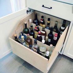 an open drawer filled with lots of bottles