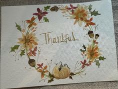 a watercolor thanksgiving card with pumpkins and leaves