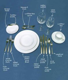 an image of a table setting with silverware and wine glasses on the table top