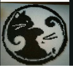 a close up of a black and white cross stitch pattern