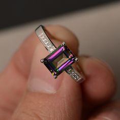 This is a gorgeous handmade creation. Its beauty is its simplicity & Elegance. The 6*8mm emerald cut mystic topaz is crafted in solid sterling silver and with rhodium plated. All item is sent in a beautiful gift box You can realize more lovely stuff clicking the link https://www.etsy.com/shop/knightjewelry?refshopsection_shophome_leftnav Please leave the correct address and you phone number for delivering successfully. Rings Emerald Cut, Topaz Rings, Rings Emerald, Mystic Topaz Ring, Semi Precious Beads, Antique Engagement, Antique Engagement Rings, Mystic Topaz, Rings Engagement