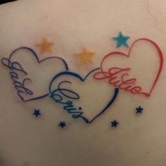 the back of a woman's stomach with two hearts and stars on it