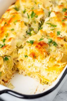 a casserole dish with broccoli, cheese and green onions in it