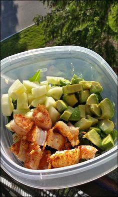 a plastic container filled with chopped up vegetables