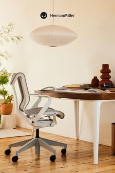 a white office chair sitting in front of a desk, with a pendant lamp hanging from the ceiling above. Modular Furniture Design, Modern Storage Furniture, Japandi Bedroom, Comfortable Workspace, Modular Office Furniture, Bedroom Nook, Office Decor Professional, Small Workspace, Modern Office Decor