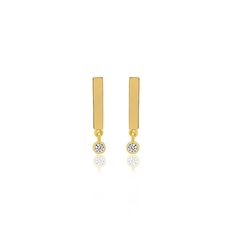 Our best-selling bar studs have been updated with a bezel set diamond drop. Handcrafted in 18-karat yellow gold, this pair of simple yet chic studs are an easy way to complement your everyday. Take your style cue from Jen and wear both in the same ear. Post backing Measures 0.5 inches in length Made with love in Los Angeles Complimentary gift wrapping provided Minimalist Gold Diamond Earrings With Bezel Setting, Minimalist Yellow Gold Diamond Earrings With Bezel Setting, Minimalist Diamond Earrings With Bezel Setting, Minimalist Everyday Diamond Earrings With Bezel Setting, Minimalist Bezel Set Diamond Earrings, Bar Studs, Bezel Set Diamond, Diamond Drops, Bezel Diamond