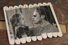 an old photo of two people sitting next to each other on toothpicks that have been placed together