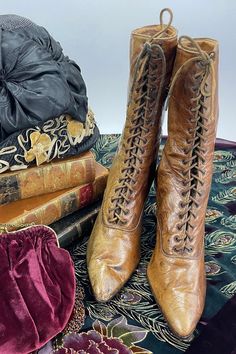 "Antique brown leather lace-up ladies boots. The inside of the boot reads '3456832212 56 Friedman-Shelby. St Louis.' There are 36 eyelets on each shoe. Original shoe laces in good condition. These ladies boots are such a rich brown color and are nicely aged. The soles are dark brown leather. The boots are lined in a cream colored cotton and have a brown 'silk' feel fabric cuff at the top/inside that is frayed from age. The boots appear to be about a size 8 but are extremely narrow, so they would Brown Leather Lace Up Boots, Womens Costume, Ladies Boots, Costume Shoes, Dress Clip, Fabric Cuff, Leather Lace Up Boots, Brown Silk, Dark Brown Leather