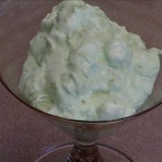 a bowl filled with whipped cream sitting on top of a table