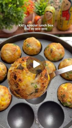 a pan filled with muffins sitting on top of a table