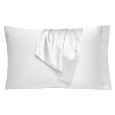 a white pillow with a satin bow on the front and back of it's cover