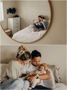 a man, woman and baby are sitting on a bed in front of a round mirror