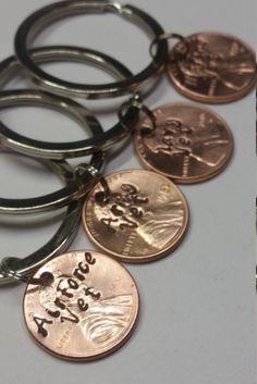 several different types of key chains with coins attached to them