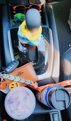 the inside of a car with various items in it