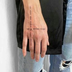 a person with a tattoo on their hand that says, you are not afraid to see the