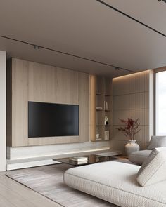 a large flat screen tv mounted to the side of a wall in a living room