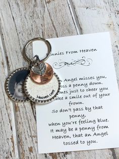 a keychain with a poem on it sitting next to a piece of paper