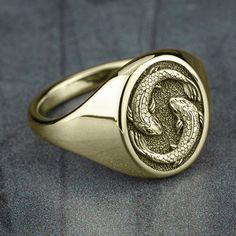 Pisces - The Fish: You are imaginative, selfless, and sensitive. Your compassion and understanding lead you to put others' needs before your own. You do not criticize others for their faults, but instead, accept people for who they are. 16mm oval signet ring 10K Yellow Gold with matching center Available in 2 fits: Luxe and Basic Available in 2 finishes: Satin and Polish Signet Rings Men, Men’s Ring, Men Rings Gold, Mens Signet Rings, Mens Jewelry Gold, Oval Signet Ring, Fish Ring, Unique Mens Rings, Golden Copper