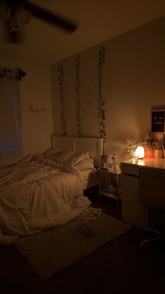 a dimly lit bedroom with a bed and dresser