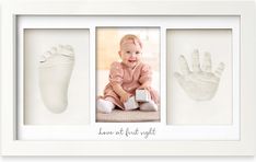 a baby's hand and foot prints are displayed in a white frame with the words love at first sight